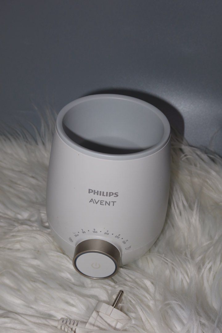 Philips Avent Fast Bottle Warmer (Category: Breastfeeding & Bottle Feeding) located in General Trias. Submitted by laiyieeeee (Listing ID 1469011458, Image 1). Description: - Authentic Philips Avent bottle warmer in clean white with a chic metallic gold control dial - Clear volume guide markings ranging from 30ml up to 330ml around the knob - Heats up milk bottles quickly, safely, and evenly - Includes original power cord with plug - Excellent wo