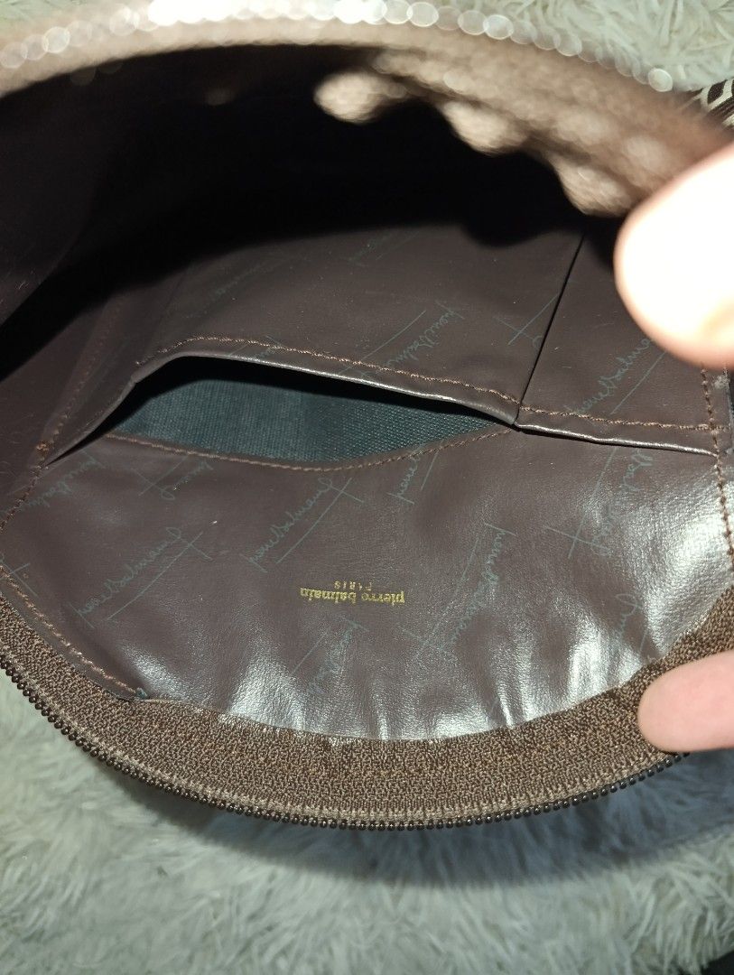 Pierre Balmain Paris Brown Monogram Cosmetic Pouch (Category: Purses & Pouches) located in Bacoor. Submitted by MommahAnnaOnlineShop (Listing ID 1469099570, Image 2). Description: - Authentic Pierre Balmain monogram makeup pouch in a chic brown and cream colorway - Secure top zip closure to keep your essentials safe - Stylish brown leather center trim with an embossed logo stamp - Clean dark brown fabric interior featuring slip pockets and a gold