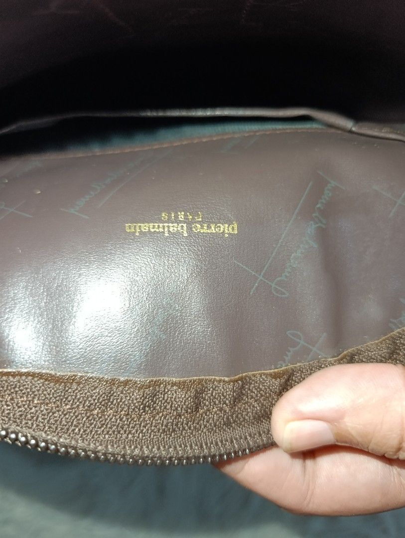 Pierre Balmain Paris Brown Monogram Cosmetic Pouch (Category: Purses & Pouches) located in Bacoor. Submitted by MommahAnnaOnlineShop (Listing ID 1469099570, Image 3). Description: - Authentic Pierre Balmain monogram makeup pouch in a chic brown and cream colorway - Secure top zip closure to keep your essentials safe - Stylish brown leather center trim with an embossed logo stamp - Clean dark brown fabric interior featuring slip pockets and a gold