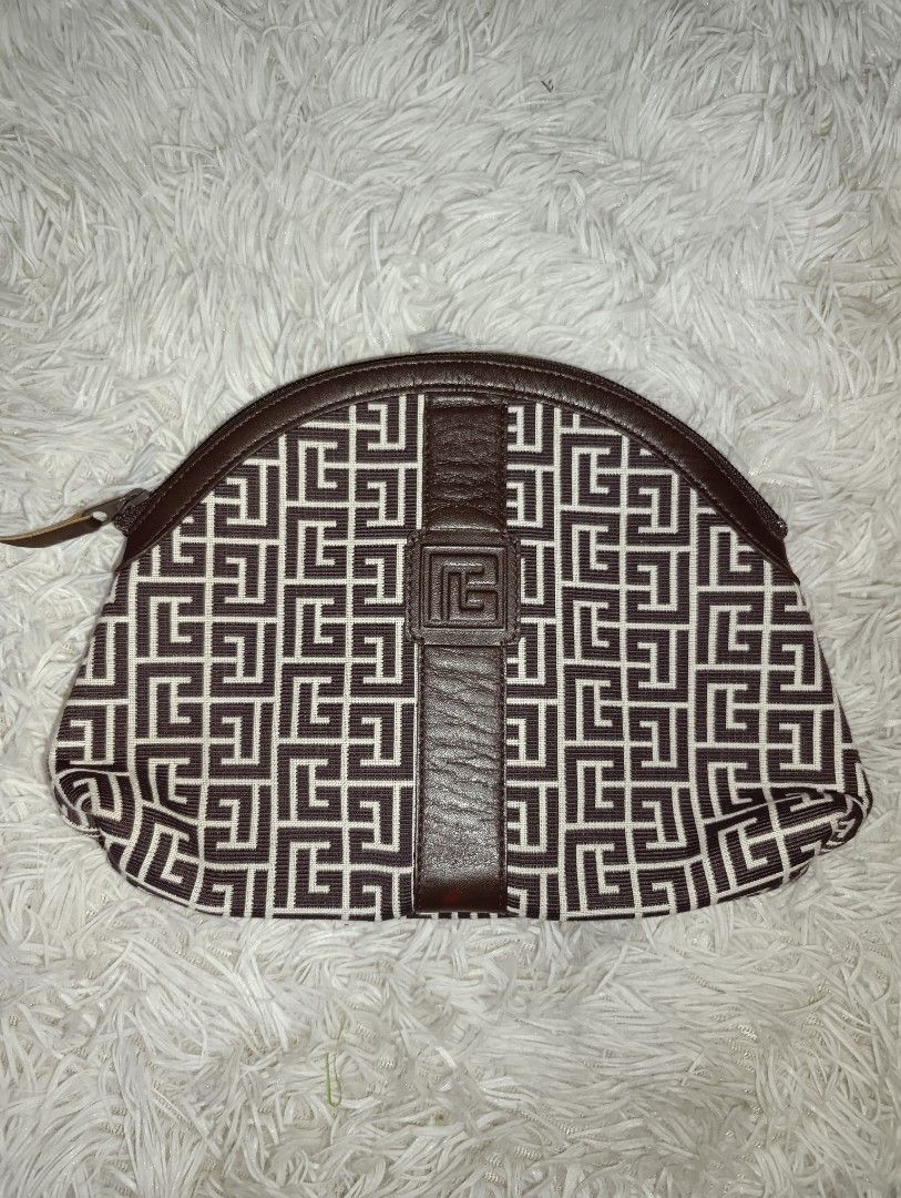 Pierre Balmain Paris Brown Monogram Cosmetic Pouch (Category: Purses & Pouches) located in Bacoor. Submitted by MommahAnnaOnlineShop (Listing ID 1469099570, Image 1). Description: - Authentic Pierre Balmain monogram makeup pouch in a chic brown and cream colorway - Secure top zip closure to keep your essentials safe - Stylish brown leather center trim with an embossed logo stamp - Clean dark brown fabric interior featuring slip pockets and a gold