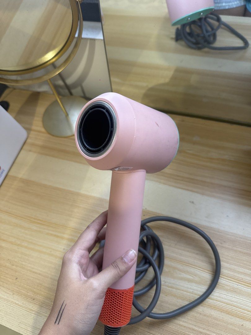 Pink and Teal Hair blower dr.flash (Category: Hair) located in Manila. Submitted by andreaaarut2 (Listing ID 1469017313, Image 3). Description: - no damage at all, just signs of usage :) - Colorway: Pink body with a bright teal top rim and orange base filter - Power: Long grey power cord with a standard plug - Controls: Two durable metal buttons conveniently located on the handle - Condition: Fully working and tested normal - Ready for pick-up or