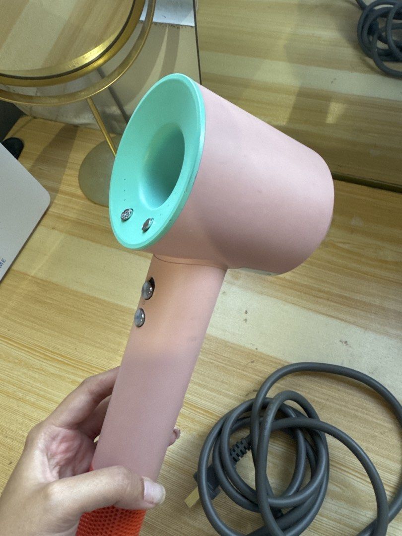 Pink and Teal Hair blower dr.flash (Category: Hair) located in Manila. Submitted by andreaaarut2 (Listing ID 1469017313, Image 2). Description: - no damage at all, just signs of usage :) - Colorway: Pink body with a bright teal top rim and orange base filter - Power: Long grey power cord with a standard plug - Controls: Two durable metal buttons conveniently located on the handle - Condition: Fully working and tested normal - Ready for pick-up or