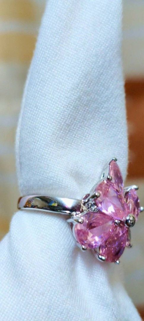 Pink crystal flower ring silver tone Size 7 (Category: Rings) located in Quezon City. Submitted by gemaicloset (Listing ID 1468976274, Image 2). Description: - Design: Sparkling pink cubic zirconia in a flower petal shape with a cute silver center bead - Band: Polished silver tone - Comfort: Lightweight and comfortable for all-day wear - Versatility: Great statement piece for daily wear or parties.