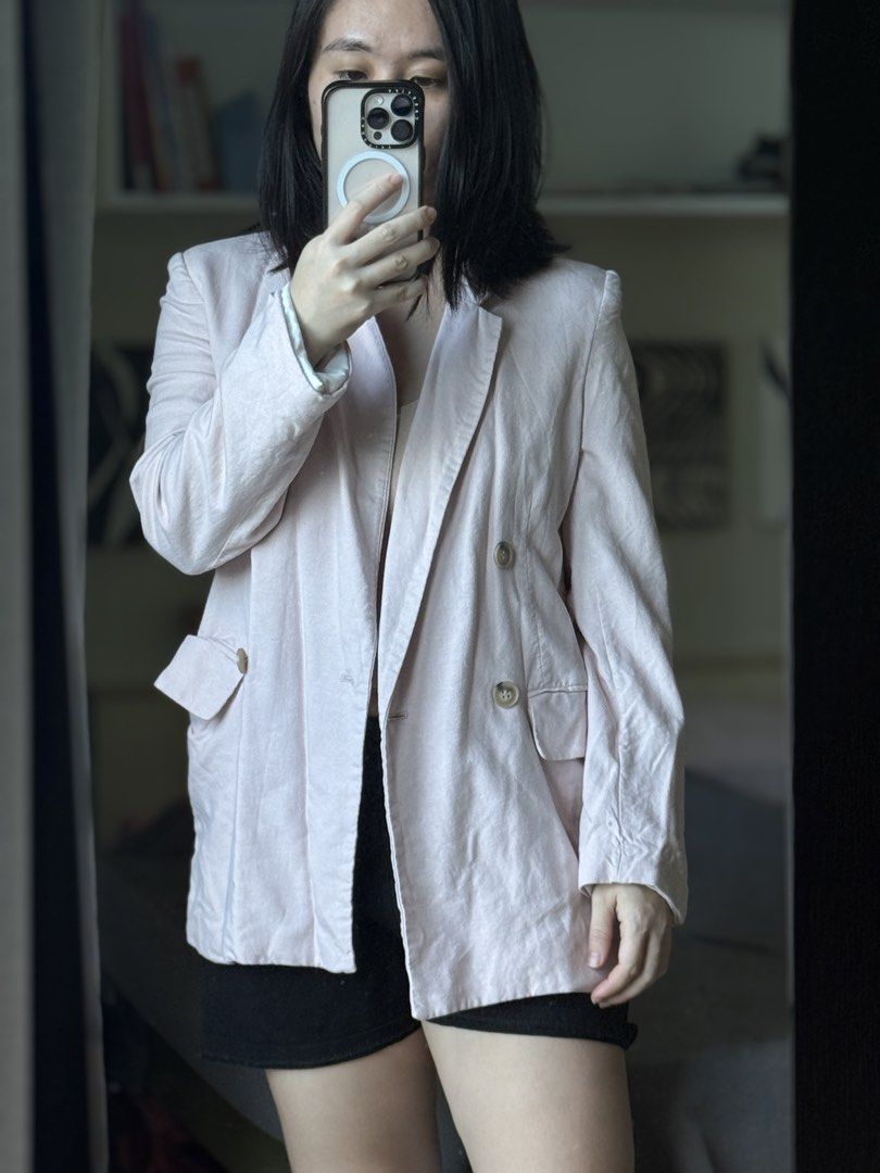 Pink double breasted oversized blazer jacket (Category: Coats, Jackets and Outerwear) located in Pasig City. Submitted by laagn.ph (Listing ID 1469090012, Image 2). Description: - Color: Light pink - Style: Oversized, double-breasted with chunky horn-style buttons - Pockets: Functional flap pockets at the hips - Fit: Relaxed through the body and sleeves for easy layering - Fabric: Lightweight and ideal for trans-seasonal weather - Versatility: Pe