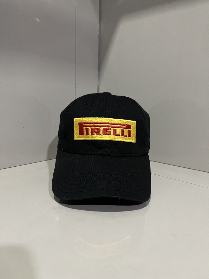 Pirelli Black Baseball Cap (Category: Caps & Hats) located in Maasin. Submitted by niconii090 (Listing ID 1468984705, Image 1). Description: - Brand: Pirelli - Color: Classic black with yellow and red embroidered logo patch - Design: Structured front panels with a curved brim - Fit: Adjustable strap closure at the back, one size fits most - Condition: Clean fabric, ready to wear .