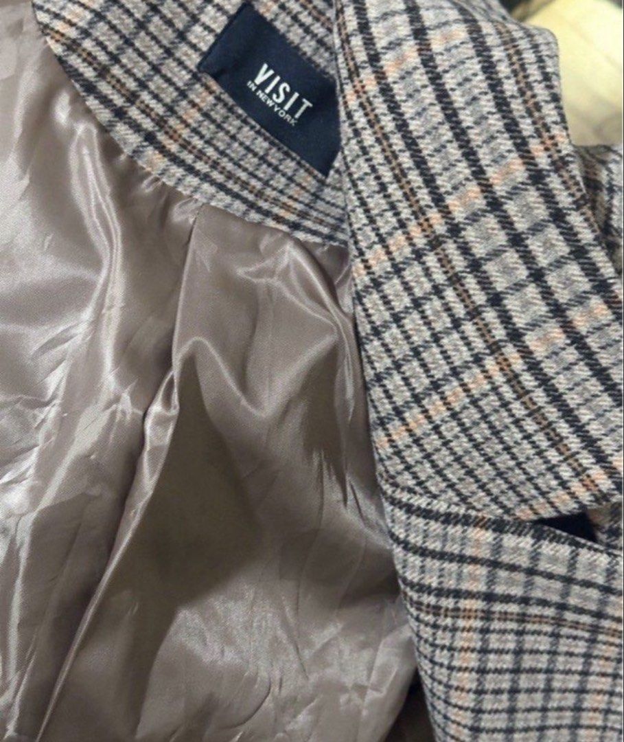 Plaid Brown Wool Autumn Coat (Category: Coats, Jackets and Outerwear) located in Manila. Submitted by eltums (Listing ID 1468994737, Image 3). Description: - Brand: Visit In New York - Design: Brown and black plaid wool coat - Features: Classic lapel collar, long sleeves, two front pockets - Details: Includes a matching tie belt to cinch the waist - Lining: Fully lined with smooth brown satin fabric Fits M-L.