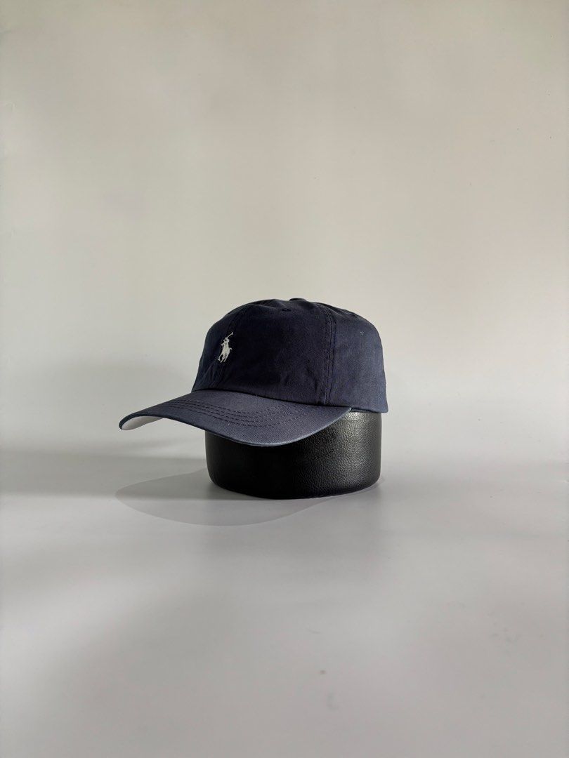 Polo Ralph Lauren Ballcap (Category: Caps & Hats) located in Malaybalay. Submitted by haulsome (Listing ID 1468997080, Image 2). Description: Polo Ralph Lauren Ballcap -In excellent condition -In Navy Blue-white colorway -Features an embroidered little pony up front -Has minor yellow stain at back of the brim -Adult size, adjustable leather strap 700php, +sf.