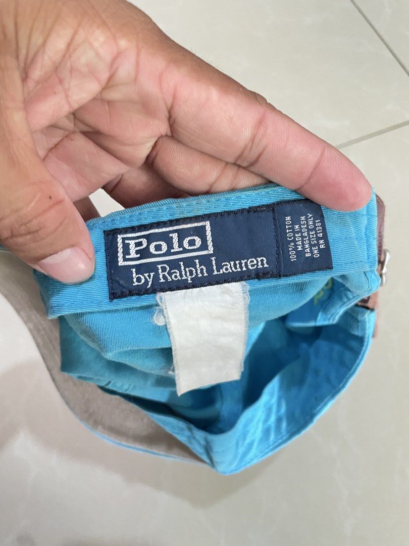 Polo Ralph Lauren Blue Cap with Leather Strap (Category: Caps & Hats) located in Iligan City. Submitted by farrisal (Listing ID 1468994829, Image 3). Description: - Authentic Polo Ralph Lauren cap in vibrant bright blue - Embroidered yellow pony logo on the front and POLO lettering on the back - Premium brown leather adjustable strap with a durable metal buckle - Made from 100% breathable cotton for all-day comfort - Classic design that easily pa