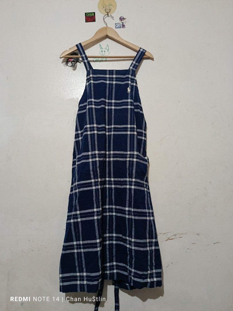 Polo Ralph Lauren Blue Plaid Apron (Category: Cleaning Tools & Supplies) located in Calamba. Submitted by chanmagpantay (Listing ID 1469085358, Image 1). Description: - Blue plaid apron - Features a square neckline, thick shoulder straps, and midi length - Authentic white embroidered Polo Ralph Lauren pony logo on the upper chest - Convenient side pockets and adjustable back tie closure - Easy to layer over t-shirts or long sleeve tops for any se