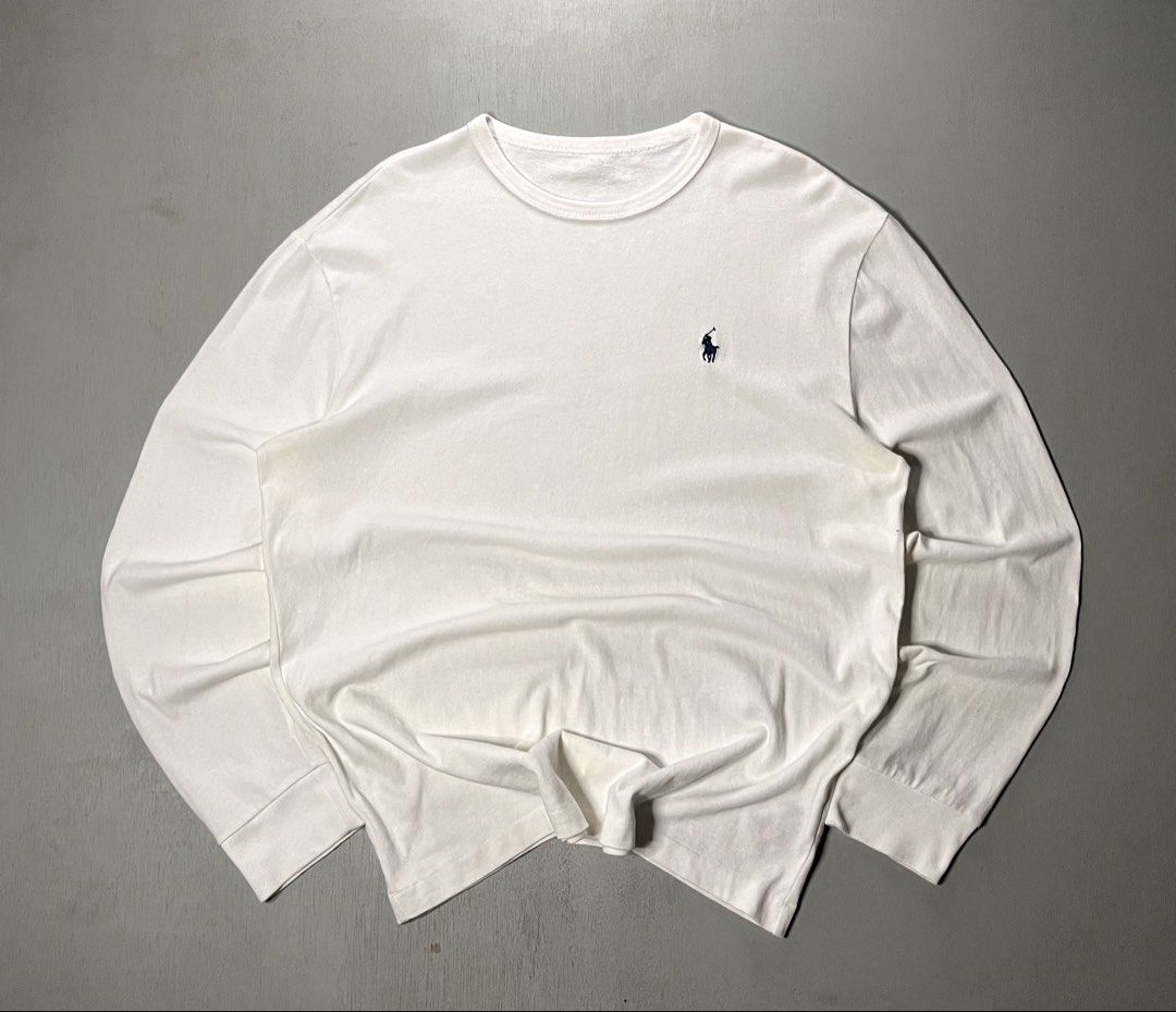 Polo Ralph Lauren White (Category: Tshirts & Polo Shirts ) located in Catbalogan. Submitted by yellfindss (Listing ID 1469131232, Image 1). Description: - Brand: Polo Ralph Lauren -22/27 - Color: Classic White with Navy Blue embroidered pony logo - Style: Long-sleeve tee with ribbed crewneck and cuffs - Material: Soft, premium cotton - Condition: Excellent / Clean look - Perfect for: Casual wear, layering, and everyday styling.