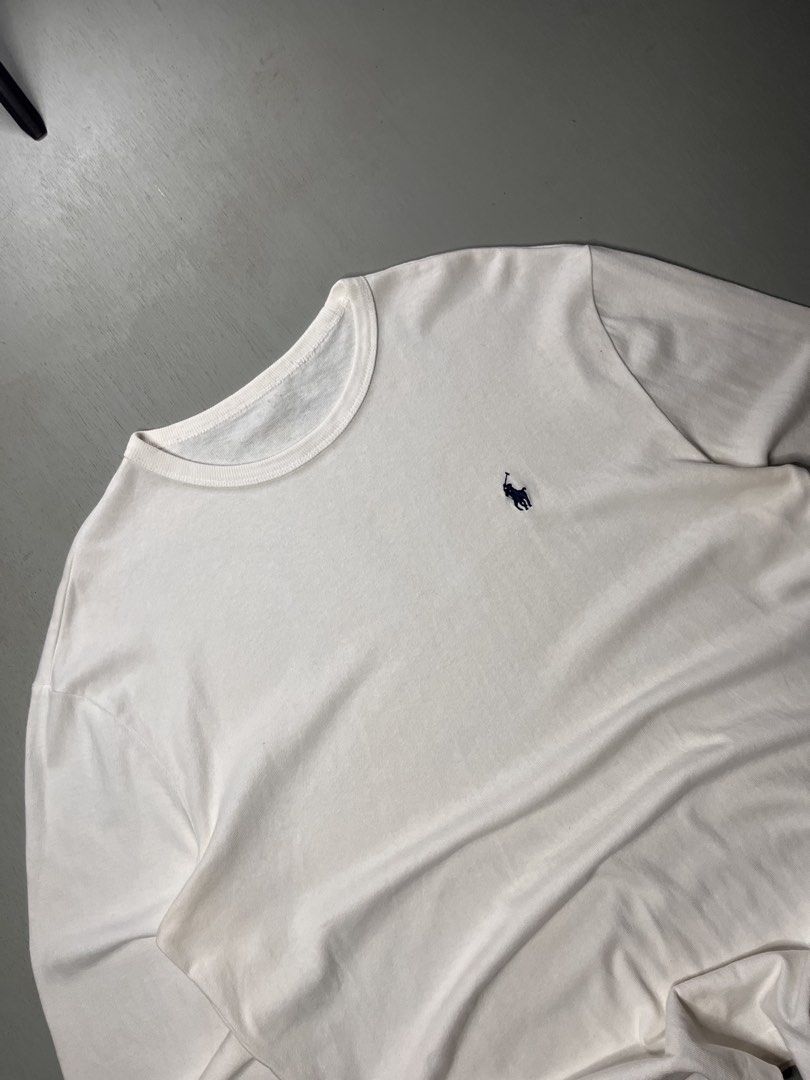 Polo Ralph Lauren White (Category: Tshirts & Polo Shirts ) located in Catbalogan. Submitted by yellfindss (Listing ID 1469131232, Image 3). Description: - Brand: Polo Ralph Lauren -22/27 - Color: Classic White with Navy Blue embroidered pony logo - Style: Long-sleeve tee with ribbed crewneck and cuffs - Material: Soft, premium cotton - Condition: Excellent / Clean look - Perfect for: Casual wear, layering, and everyday styling.