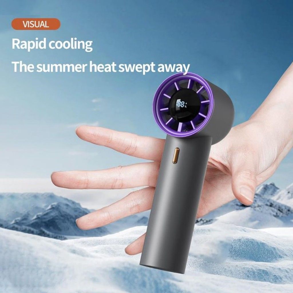 Portable Handheld Mini Fan with LCD Digital Display (Category: Fans) located in Dasmarinas. Submitted by sellvation (Listing ID 1469080975, Image 1). Description: - Sleek cylindrical design with a stylish purple-accented turbine head - Built-in LCD screen displays real-time battery level and wind speed settings - Powered by an intelligent AI protection chip for safe and reliable daily use - Compact and lightweight, perfect for carrying in your ba