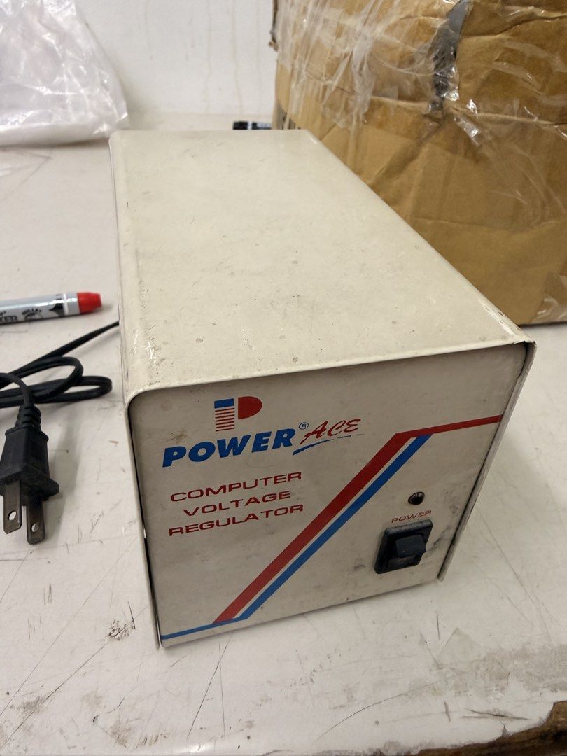 Power Ace Computer Voltage Regulator (Category: Computer Parts) located in Manila. Submitted by officialrodz (Listing ID 1468952574, Image 1). Description: - Brand/Model: Power Ace Computer Voltage Regulator Unit - Build: Heavy-duty metal housing for reliable electrical output stabilization - Power: Standard power cable with a 2-prong plug attached - Controls: Front power switch equipped with an indicator light - Condition: Shows minor wear and d