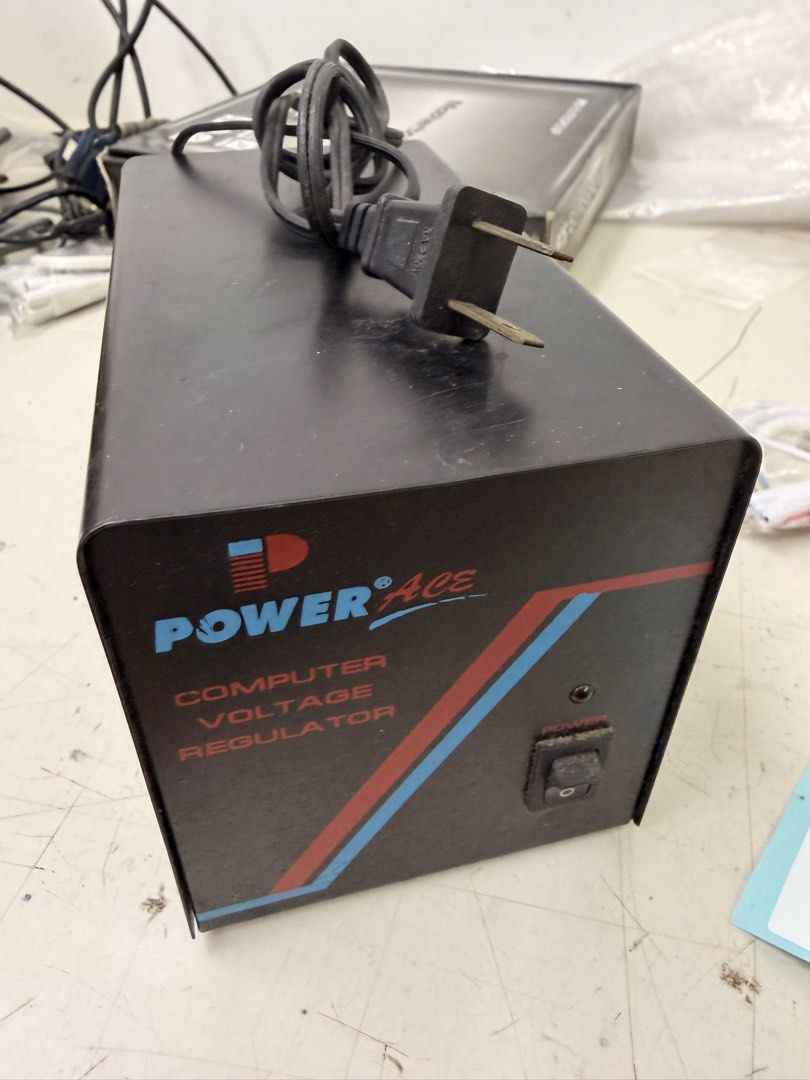 Power Ace Computer Voltage Regulator (Category: Computer Parts) located in Manila. Submitted by officialrodz (Listing ID 1468952574, Image 2). Description: - Brand/Model: Power Ace Computer Voltage Regulator Unit - Build: Heavy-duty metal housing for reliable electrical output stabilization - Power: Standard power cable with a 2-prong plug attached - Controls: Front power switch equipped with an indicator light - Condition: Shows minor wear and d
