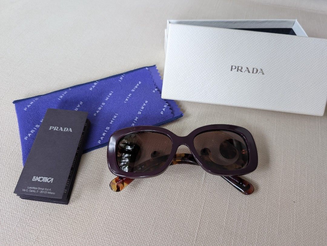 Prada Baroque Sunglasses (Category: Sunglasses & Eyewear) located in Pasig City. Submitted by ejereyes (Listing ID 1468971889, Image 1). Description: Prada Minimal Baroque (SPR 27O) sunglasses - Purple frame with tortoiseshell swirl temples - Guaranteed authentic Includes original white Prada box case Excellent condition, hinges are smooth RFS: Downsizing personal collection :) Location is Ugong, Pasig.