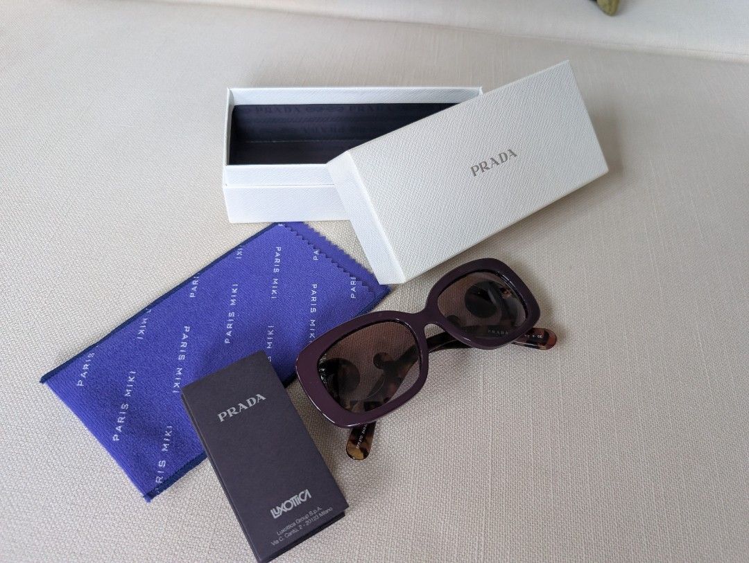 Prada Baroque Sunglasses (Category: Sunglasses & Eyewear) located in Pasig City. Submitted by ejereyes (Listing ID 1468971889, Image 2). Description: Prada Minimal Baroque (SPR 27O) sunglasses - Purple frame with tortoiseshell swirl temples - Guaranteed authentic Includes original white Prada box case Excellent condition, hinges are smooth RFS: Downsizing personal collection :) Location is Ugong, Pasig.
