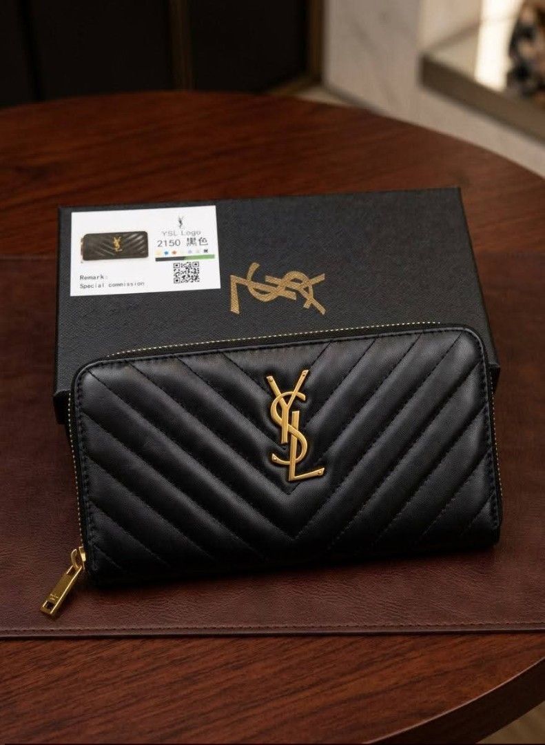 Prada Black Quilted Leather Wallet with Box (Category: Luxury Bags & Wallets) located in Manila. Submitted by iliasjen3082126 (Listing ID 1468997264, Image 2). Description: Prada black quilted leather wallet - Elegant gold-tone hardware with prominent front logo lettering - Structured rectangular shape featuring clean, precise stitching - Keeps your cards, cash, and essentials safe and secure - Comes with a matching black branded gift box (great 