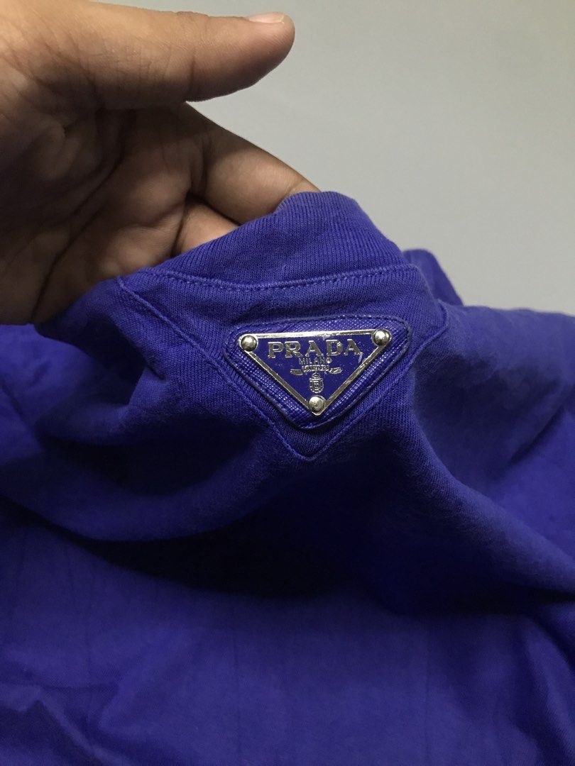 Prada Crewneck Triangle Logo Shirt (Category: Luxury Apparel) located in Calbayog City. Submitted by luxtreetwear (Listing ID 1469097603, Image 2). Description: Prada Crewneck Triangle Logo Shirt Good Condition Size M on tag 22x27.5 Colorate 9.1/10 issue minimal fading on the neck line.