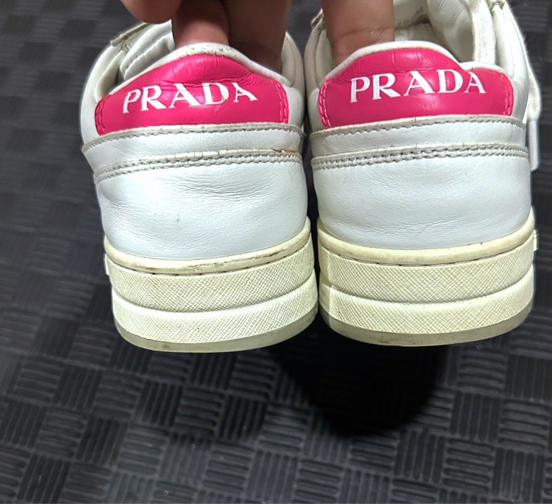 Prada Downtown Leather Sneakers (Category: Sneakers) located in Antipolo. Submitted by shopaho_nique (Listing ID 1469072083, Image 3). Description: AUTHENTIC Prada Downtown Leather Sneakers (White/Pink) Selling an authentic pair of women’s Prada Downtown low-tops in white with vibrant fuchsia pink accents and the iconic enameled triangle logo. • Model: Prada Downtown Low-Top (Style Code: 1E792M) • Size: EU 36 (Fits EU 36 - 36.5) • Material: 100% 