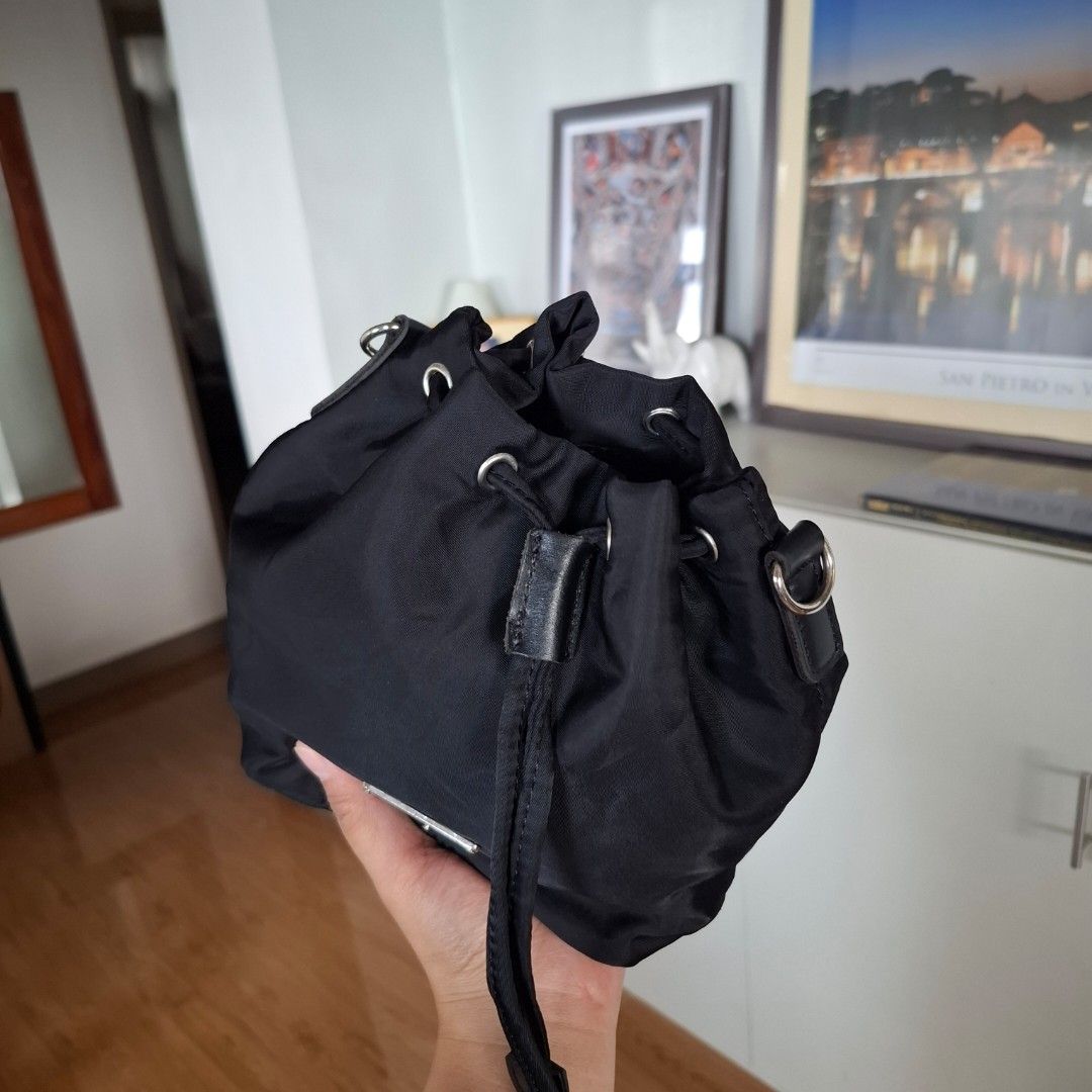 Prada Drawstring Bucket Pouch (Free SF) (Category: Purses & Pouches) located in Baguio. Submitted by bycharmaebuys (Listing ID 1468989333, Image 3). Description: Drawstring Pouch/wristlet Brand: Prada Self-authenticate 💯 ‼️ SALE PRICE: 590.00, FREE SHIPPING NATIONWIDE‼️ First to pay basis Large Size, bucket type, drawstring Dimension: 8 x 6 x 4 (inches) Nylon Material Black color w/ silver hardware With provision for sling bag Original wristlet 