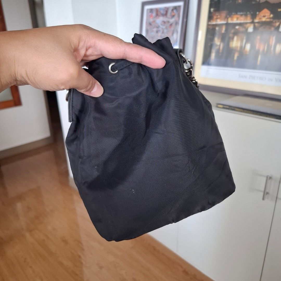 Prada Drawstring Bucket Pouch (Free SF) (Category: Purses & Pouches) located in Baguio. Submitted by bycharmaebuys (Listing ID 1468989333, Image 2). Description: Drawstring Pouch/wristlet Brand: Prada Self-authenticate 💯 ‼️ SALE PRICE: 590.00, FREE SHIPPING NATIONWIDE‼️ First to pay basis Large Size, bucket type, drawstring Dimension: 8 x 6 x 4 (inches) Nylon Material Black color w/ silver hardware With provision for sling bag Original wristlet 