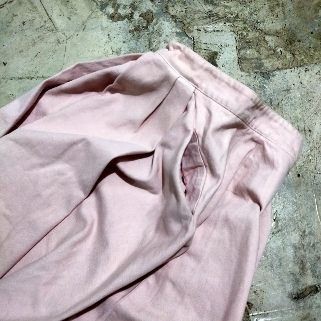 Prada Milano Pink Pleated Skirt (Category: Skirts) located in Zamboanga. Submitted by _oliverbmth (Listing ID 1468981942, Image 3). Description: - Brand: Prada Milano - Color: Pink - Material: 100% Cotton - Style: Mid-length flared cut with front pleats - Features: Convenient side pockets, zipper closure with branded hardware, and subtle triangular embroidered patch near the hem - Authenticity details: Blue brand label stitched inside near the wa