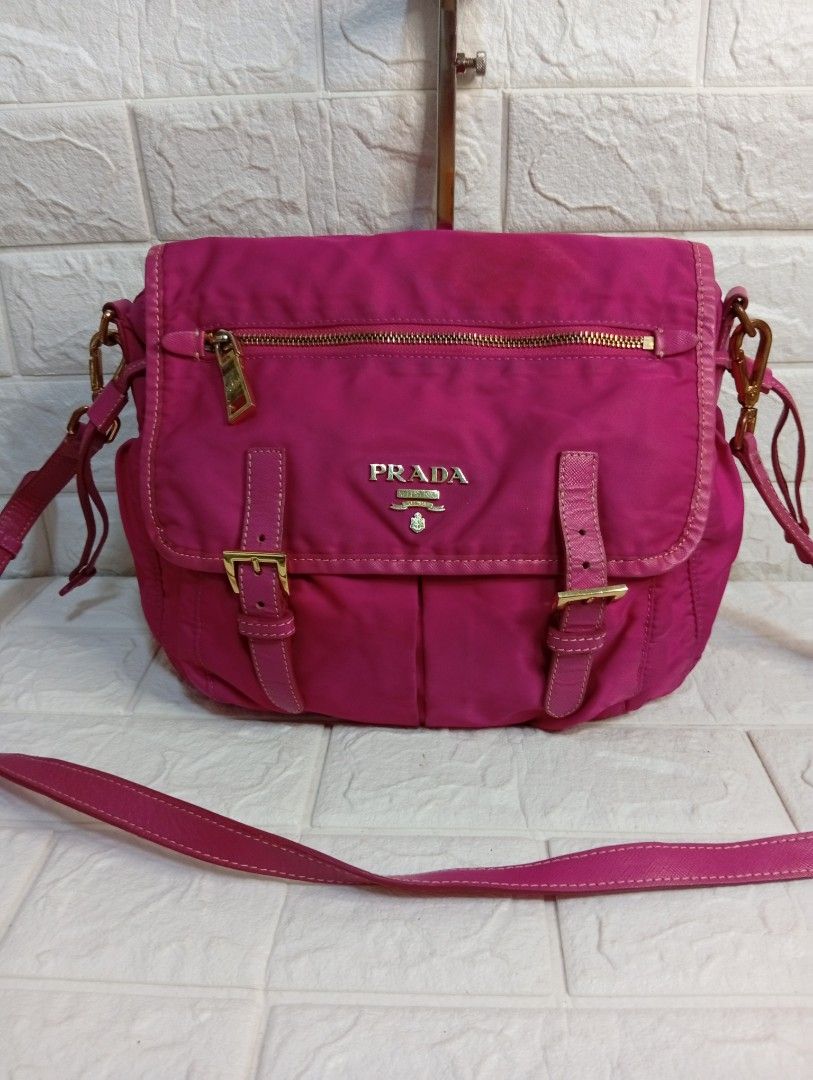 Prada Pink Tessuto Nylon Messenger Bag (Category: Luxury Bags & Wallets) located in Las Pinas. Submitted by etoksi1234 (Listing ID 1469119291, Image 1). Description: Pre-loved Prada bright pink nylon crossbody bag featuring gold hardware, a front flap with dual buckles, and adjustable strap. Made in Italy..