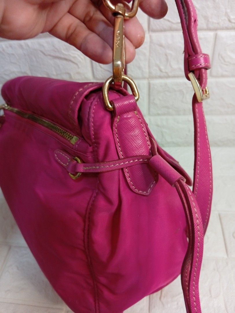 Prada Pink Tessuto Nylon Messenger Bag (Category: Luxury Bags & Wallets) located in Las Pinas. Submitted by etoksi1234 (Listing ID 1469119291, Image 3). Description: Pre-loved Prada bright pink nylon crossbody bag featuring gold hardware, a front flap with dual buckles, and adjustable strap. Made in Italy..