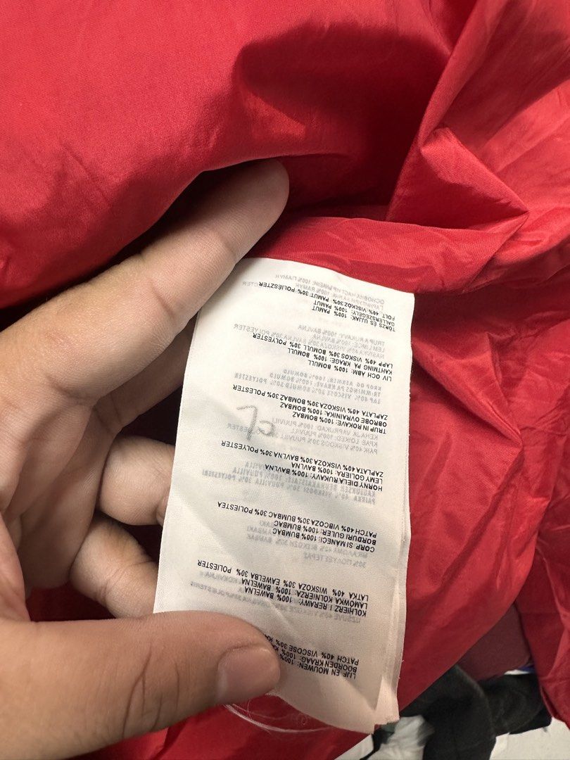 Prada Red Nylon Zip Jacket Size 42 (Category: Coats, Jackets and Outerwear) located in Manila. Submitted by rashidgaddi (Listing ID 1468933773, Image 3). Description: - Brand: Prada - Item: Nylon Jacket - Color: Bright Red with light blue inner collar tag - Size: 42 (Tag attached) - Origin: Made in Mauritius - Material: Viscose, polyester, and other fabric blends - Features: Full front zipper with branded metal pull, clean red inner lining - Cond