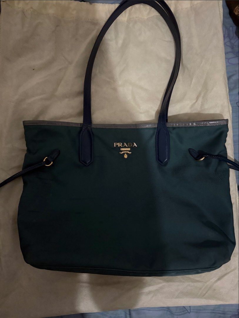 Prada Tessuto Nylon (Category: Luxury Bags & Wallets) located in Quezon City. Submitted by jleebeanana (Listing ID 1469026922, Image 3). Description: ✨Decluttering -- RFS: too many bags✨ Selling my Prada Tessuto Nylon Tote Bag 🖤 With Certificate of Authenticity 🖤 Good condition, no major flaws 🖤 Normal signs of use (please manage your expectations) 📍 Location: Quezon City 💰 ₱8,799.00 Guaranteed Authentic Prada tote at a great price! 🤍 Perfe