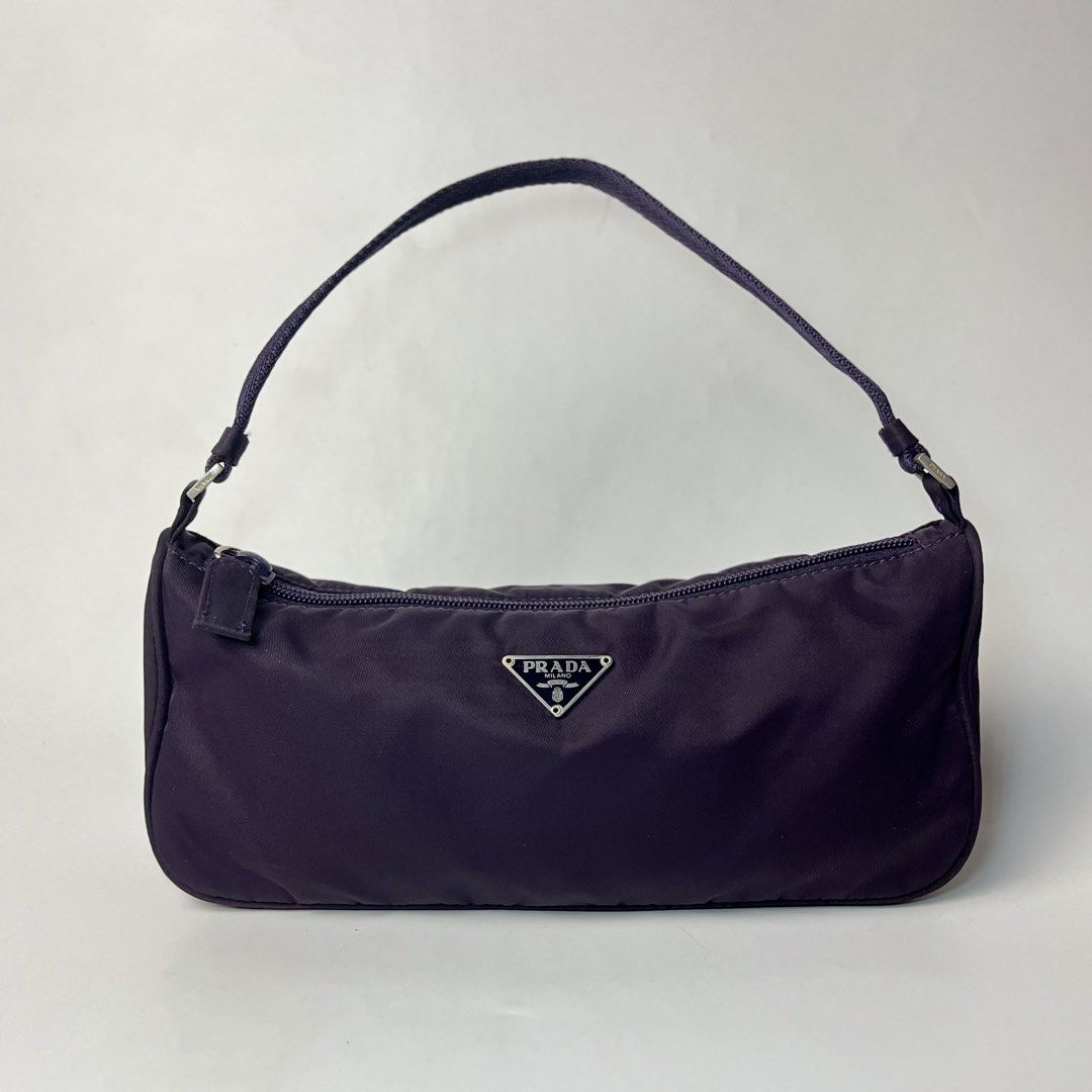 Prada Tessuto Nylon Mini Shoulder Bag (Category: Luxury Bags & Wallets) located in Manila. Submitted by streetsavvy (Listing ID 1469024716, Image 1). Description: Prada Tessuto Nylon Mini Shoulder Bag Width: 10” Height: 4.5” Depth: 2.5” Strap Drop: 5” Measured in Inches features a classic curved mini hobo profile with clean, geometric lines that taper subtly at the sides. Its flexible Tessuto nylon body allows the bag to hold its shape naturally 