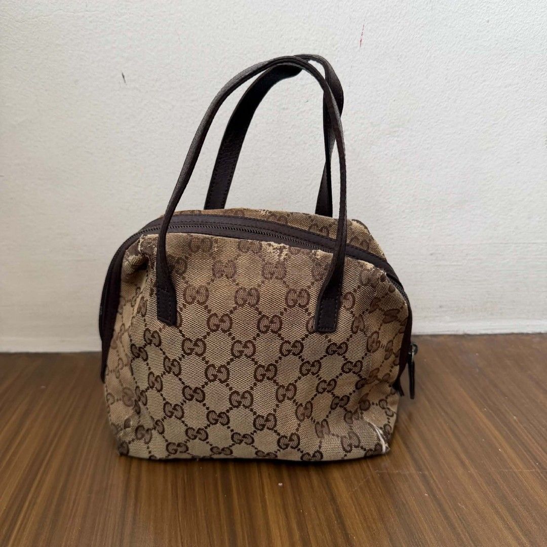 PRE OWNED AUTHENTIC GUCCI GG CANVAS MINI BAG (Category: Luxury Bags & Wallets) located in Paranaque City. Submitted by Glamfahd (Listing ID 1469072263, Image 3). Description: Pre Owned Authentic GUCCI GG Bag Inclusion/s: None Condition Well Used condition Marks on exterior Marks on interior Abrasions on exterior visible in close inspection hence the price Bag is really a great buy! Please manage your expectations as you are buying an authentic se