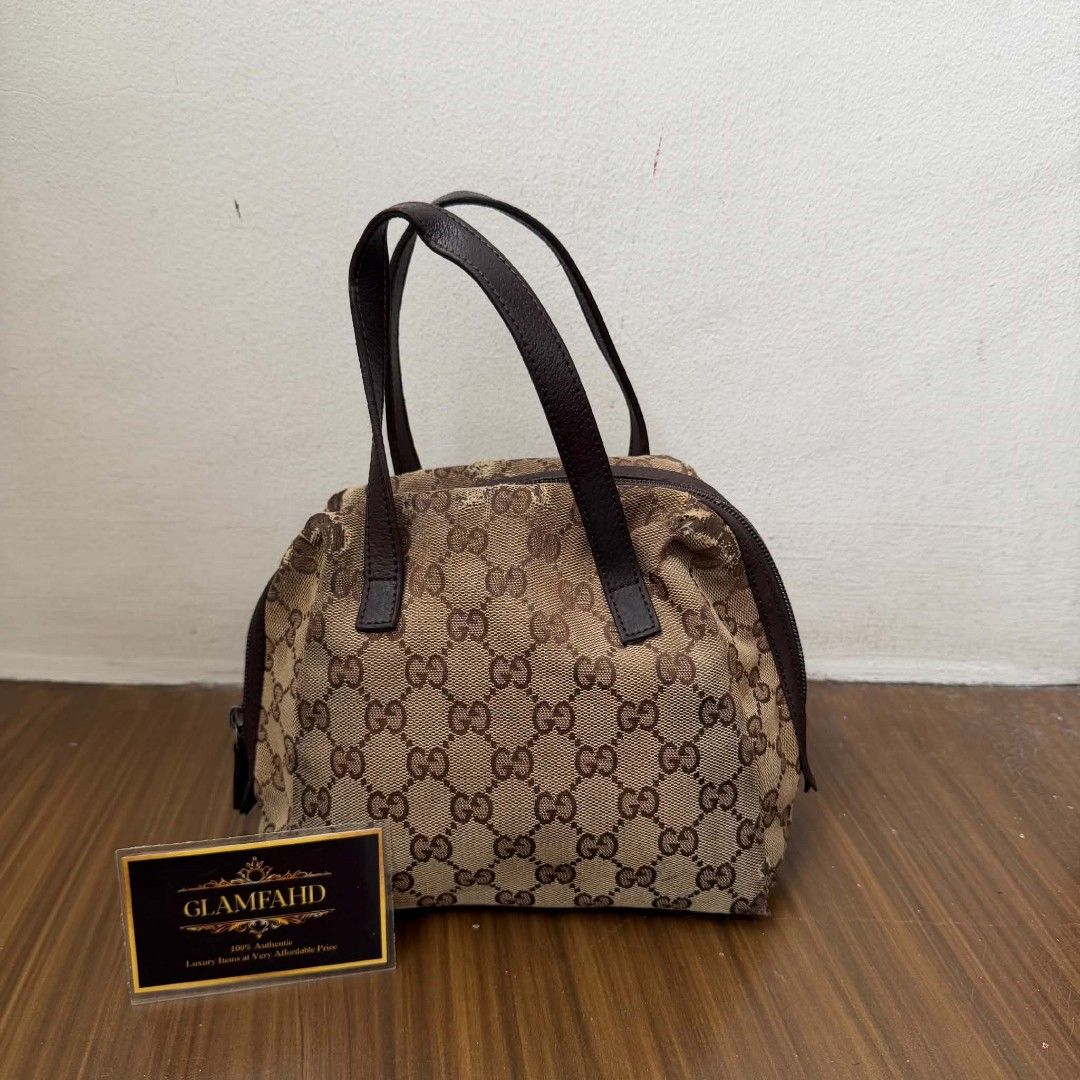 PRE OWNED AUTHENTIC GUCCI GG CANVAS MINI BAG (Category: Luxury Bags & Wallets) located in Paranaque City. Submitted by Glamfahd (Listing ID 1469072263, Image 1). Description: Pre Owned Authentic GUCCI GG Bag Inclusion/s: None Condition Well Used condition Marks on exterior Marks on interior Abrasions on exterior visible in close inspection hence the price Bag is really a great buy! Please manage your expectations as you are buying an authentic se