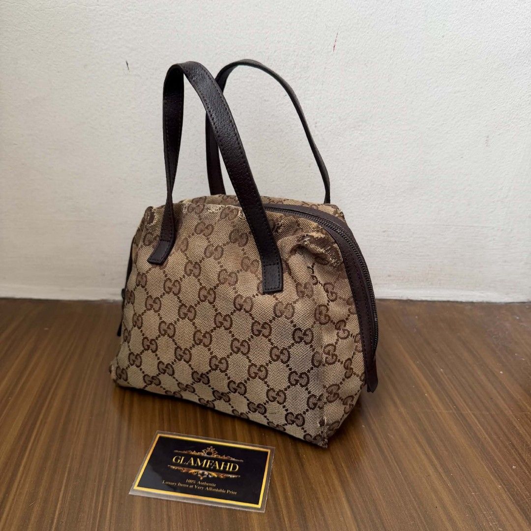 PRE OWNED AUTHENTIC GUCCI GG CANVAS MINI BAG (Category: Luxury Bags & Wallets) located in Paranaque City. Submitted by Glamfahd (Listing ID 1469072263, Image 2). Description: Pre Owned Authentic GUCCI GG Bag Inclusion/s: None Condition Well Used condition Marks on exterior Marks on interior Abrasions on exterior visible in close inspection hence the price Bag is really a great buy! Please manage your expectations as you are buying an authentic se
