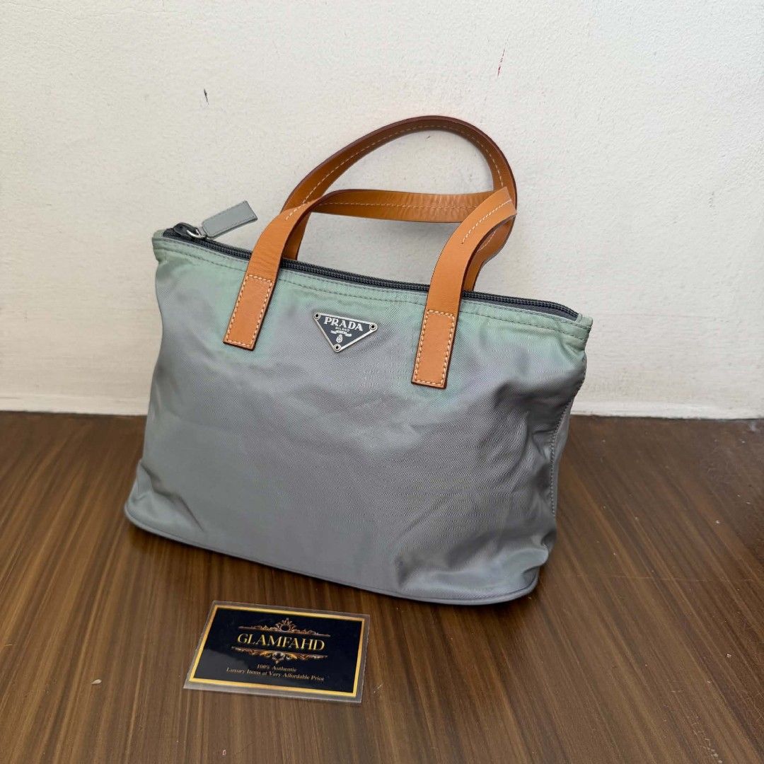 PRE OWNED AUTHENTIC PRADA NYLON BAG (Category: Luxury Bags & Wallets) located in Paranaque City. Submitted by Glamfahd (Listing ID 1469076370, Image 2). Description: Pre Owned Authentic PRADA Bag Inclusion/s: None Condition Well Used condition Marks on exterior Marks on interior Tolerable fade of color on few area visible in close inspection Bag is really a great buy! Please manage your expectations as you are buying an authentic second hand item