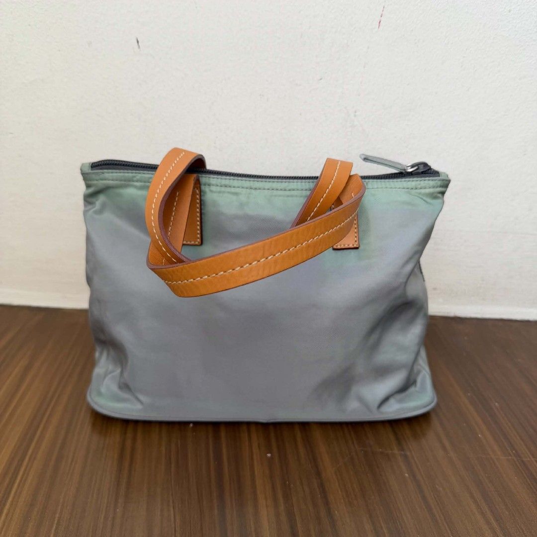 PRE OWNED AUTHENTIC PRADA NYLON BAG (Category: Luxury Bags & Wallets) located in Paranaque City. Submitted by Glamfahd (Listing ID 1469076370, Image 3). Description: Pre Owned Authentic PRADA Bag Inclusion/s: None Condition Well Used condition Marks on exterior Marks on interior Tolerable fade of color on few area visible in close inspection Bag is really a great buy! Please manage your expectations as you are buying an authentic second hand item