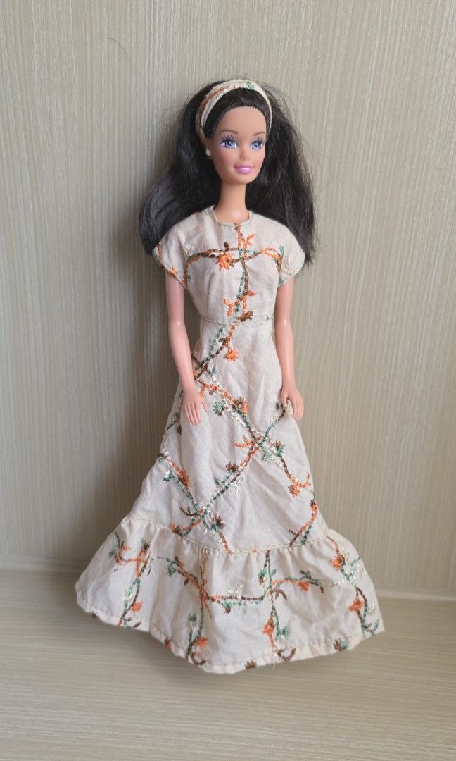 Preloved 90s Filipina Barbie (Category: Kids Toys) located in Luna. Submitted by macygreyz82 (Listing ID 1468940781, Image 1). Description: - Made in the Philippines by Richwell - Wearing handsewn dress by seller - With open toe mint green shoes (bakya) No issue MOP: GCash MOD: J&T only Item Location: La Union.