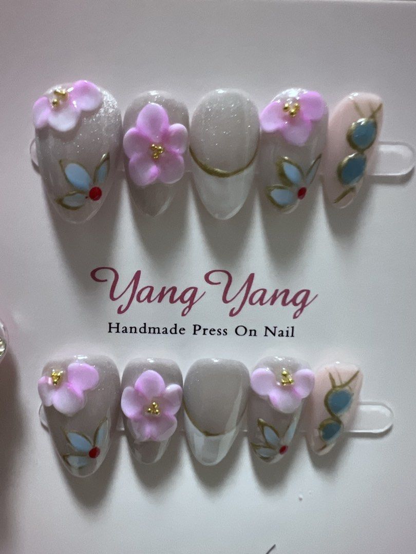 Press On Nail Sets Size Medium, 3d flowers, rhinestones (Category: Hands & Nails) located in Makati City. Submitted by kllevado (Listing ID 1469084731, Image 2). Description: Php 150 per set Never been used. Size: Medium Shape & Length: Short Almond Comes with free nail application kit Can meet up in Glorietta 12-1pm weekdays or pick up biñan / san pedro laguna area. Delivery fee c/o buyer. See other available designs. .
