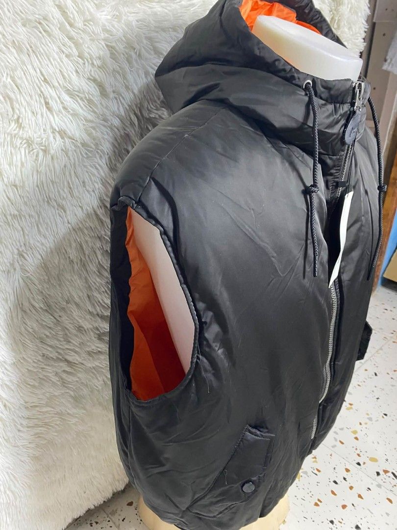 Puffer Vest (Category: Vests) located in Baguio. Submitted by aine_laine (Listing ID 1469161683, Image 3). Description: black hooded puffer gilet or vest by Zara, featuring a front zipper, snap-button pockets, and an orange lining inside the hood — pwde unisex Xs on tag Runs big Best fit Medium (Men) Large (women) 3pcs avail.