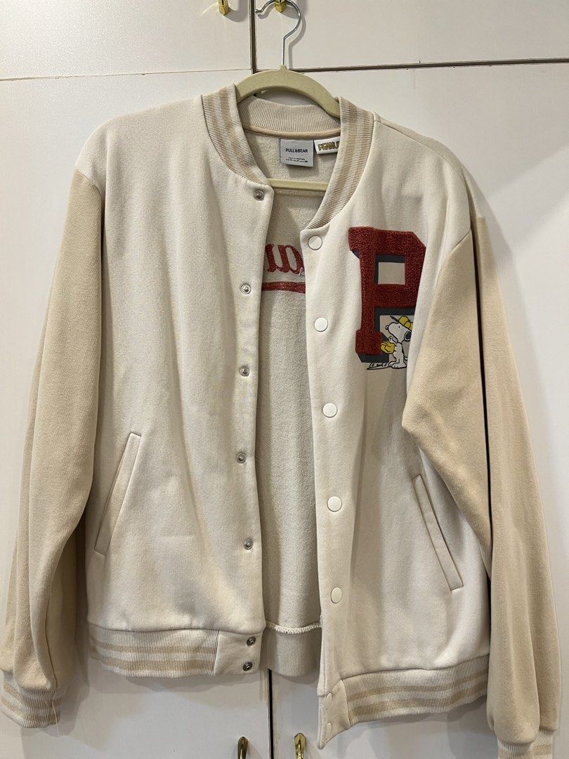 Pull & Bear x Peanuts Varsity Jacket Cream Size M (Category: Coats, Jackets and Outerwear) located in Quezon City. Submitted by iam.yanuhh (Listing ID 1469108146, Image 1). Description: - used twice only - Authentic Pull & Bear x Peanuts collaboration varsity jacket - Color: Cream body with beige sleeves - Size: EUR M, USA M, MEX 28 - Material: Warm cotton blend, made in Portugal - Design details: Snap-button closure, striped ribbed cuffs and hem