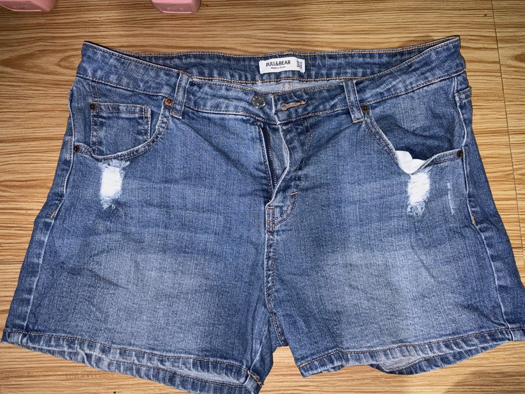 Pull&Bear Distressed Denim Shorts Size EUR 42 (Category: Shorts) located in Siquijor. Submitted by yhostuff (Listing ID 1469016145, Image 1). Description: Pull&Bear denim shorts in a medium blue wash. Mid-rise fit with distressed details near the front pockets. Classic five-pocket styling with back pockets and a leather patch at the waistband. Metal button closure and zip fly. Size EUR 42, USA 10, MEX 32. Women: L-XL RFS: Downsizing P.S. Visit my
