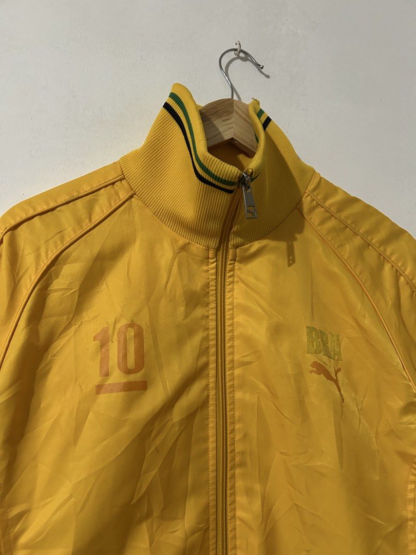Puma Brazil Track Jacket Yellow Size M (Category: Coats, Jackets and Outerwear) located in Manila. Submitted by livedog-d301 (Listing ID 1468936332, Image 2). Description: - Brand: Puma - Theme: Brazil Football / Retro - Color: Bright yellow with green and black accents - Size: Medium (M) - Design: Iconic number 10 printed on front and back, PUMA leaping cat logo, and Brasil branding on chest - Details: Full zip closure, tall ribbed collar, strip