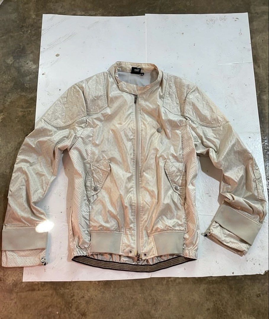 Puma by Mihara Yasuhiro Perf Riders Jacket Size XL (Category: Coats, Jackets and Outerwear) located in Manila. Submitted by declutterwithme07 (Listing ID 1468998967, Image 1). Description: - Brand: Puma by Mihara Yasuhiro Collaboration - Size: XL (Made in Japan) - Color: Off-white - Material: Lightweight perforated nylon with quilted shoulder panels - Features: Full zip front with dual sliders, functional snap pockets, and adjustable drawcord hem