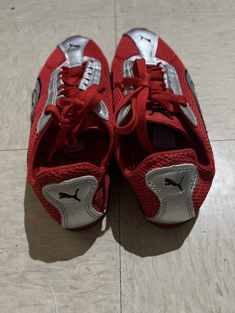 Puma Red Silver Sneakers Size US 9 (Category: Sneakers) located in Quezon City. Submitted by Zandee (Listing ID 1469092545, Image 2). Description: - Brand: Puma - Color: Red mesh with silver leather overlays and black branding - Size: US 9 / EUR 42 / UK 8 - Features: Lace-up closure, iconic black and white side stripes, durable rubber outsole - Condition: Clean, red laces intact, minimal wear on soles - Origin: Made in Cambodia.