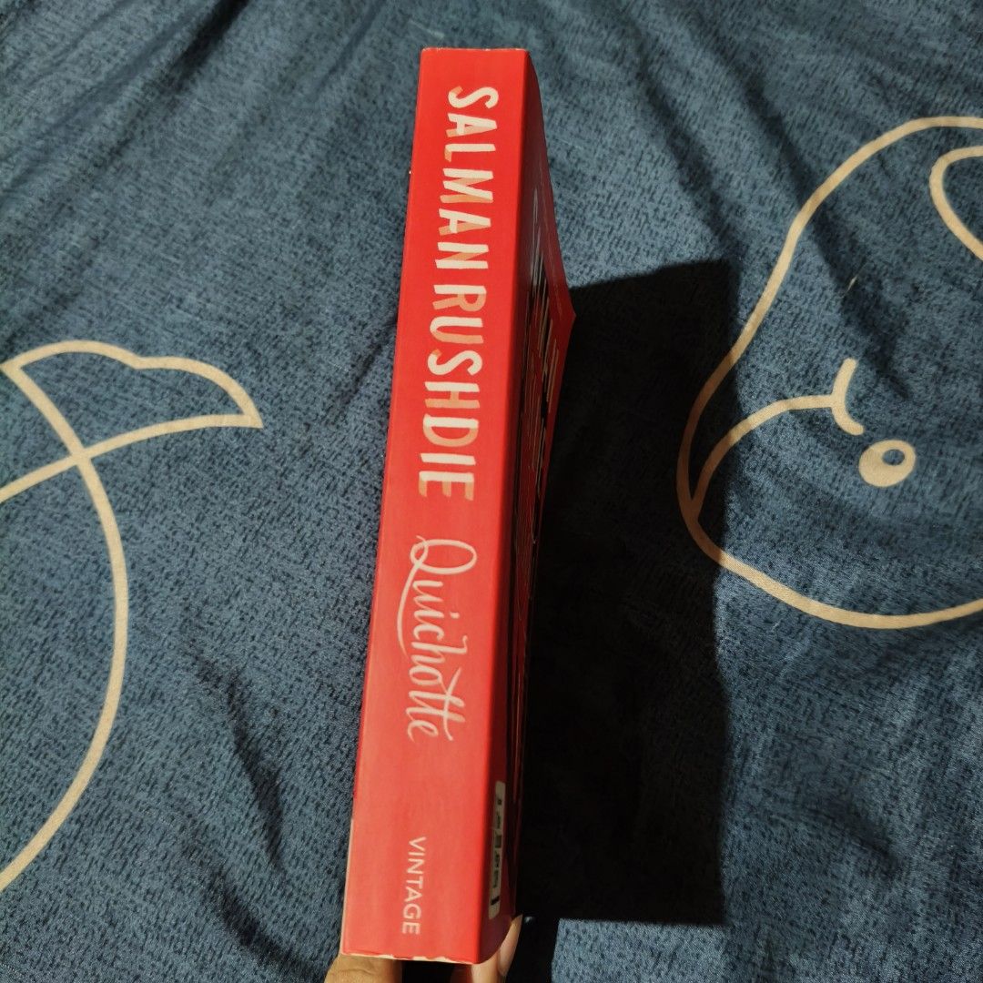 Quichotte by Salman Rushdie (Category: Storybooks) located in Santo Domingo. Submitted by rajjinni (Listing ID 1469060420, Image 3). Description: - Title: Quichotte by Salman Rushdie - Edition: Vintage paperback with a striking bright red cover - Recognition: Features the Booker Prize 2019 shortlist badge - Condition: Clean, intact spine with slight page edge yellowing due to age - Perfect addition for fans of celebrated contemporary literature.