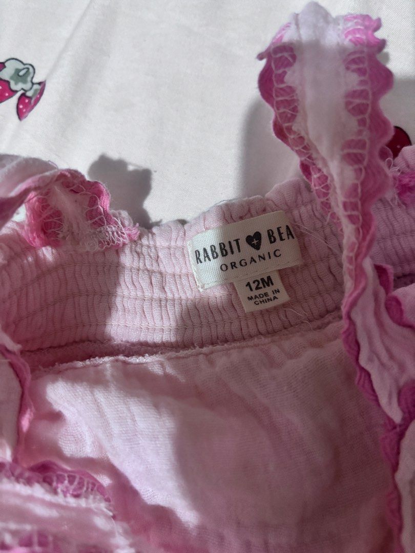 Rabbit Bear Organic Pink (Category: Babies & Kids Fashion) located in Imus. Submitted by xinyi133 (Listing ID 1468997388, Image 2). Description: - Brand/Style: Rabbit Bear organic cotton baby dress - Size: 12M - Color: Soft pink with bright pink trim - Design: Ruffled shoulder straps, gathered bodice, and scallop embroidery hem - Comfort: Lightweight, highly breathable fabric ideal for warm weather - Convenience: Easy slip-on design.