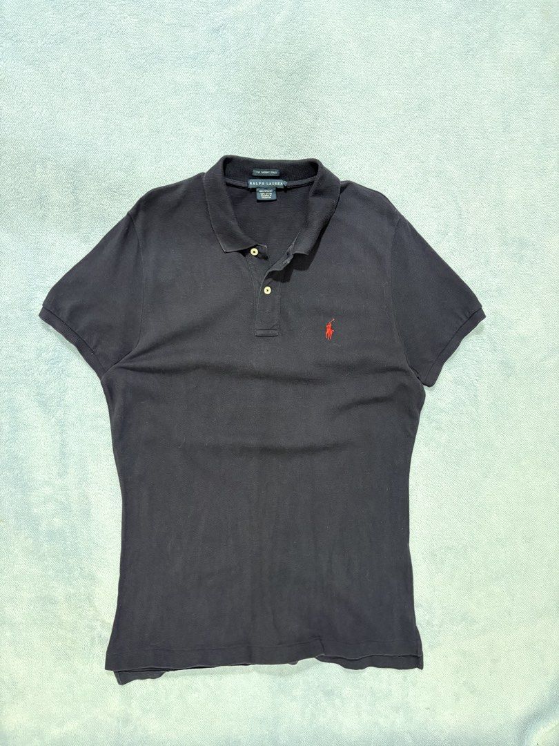 RALPH LAUREN Navy Polo Shirt (Category: Tshirts & Polo Shirts ) located in Alburquerque. Submitted by ukay_ni_edgar (Listing ID 1469017971, Image 1). Description: Understated luxury with a classic navy colorway and signature red pony embroidery. A timeless staple for any wardrobe..