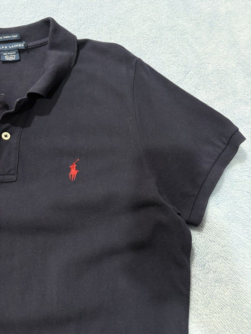 RALPH LAUREN Navy Polo Shirt (Category: Tshirts & Polo Shirts ) located in Alburquerque. Submitted by ukay_ni_edgar (Listing ID 1469017971, Image 3). Description: Understated luxury with a classic navy colorway and signature red pony embroidery. A timeless staple for any wardrobe..