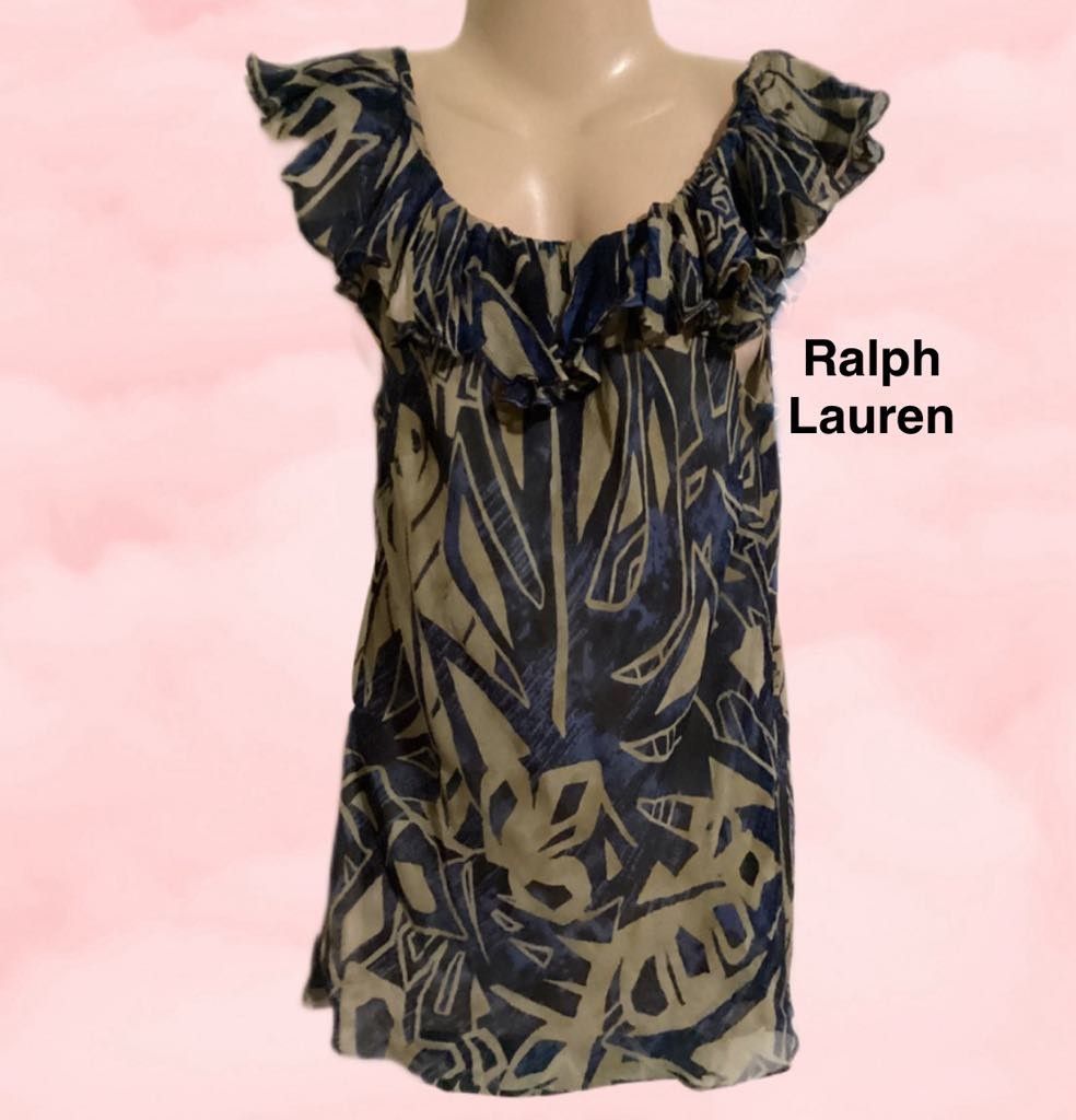 Ralph Lauren Ruffled Abstract Print Blouse (Category: Blouses) located in Paranaque City. Submitted by calm_youngstore7 (Listing ID 1469048774, Image 1). Description: - Brand: Ralph Lauren (Classic green tag) - Design: Blue and khaki abstract print with scoop neckline and ruffled trim - Sleeves: Chic cap sleeves - Fabric: Lightweight sheer outer layer with solid neutral lining - Versatility: Easy to dress up for the office or keep casual for week