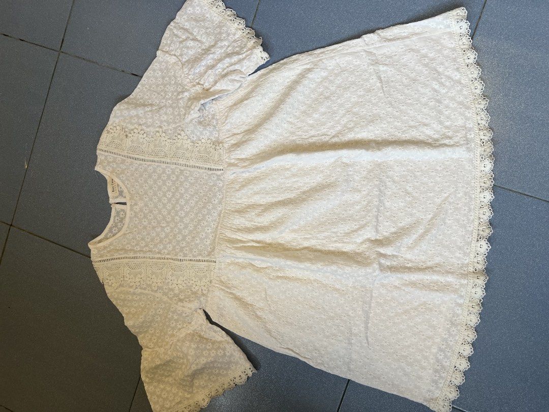 Ray Cassin White Embroidered Lace Blouse (Category: Blouses) located in Tabaco. Submitted by edmarbron (Listing ID 1469089880, Image 3). Description: - Brand/Style: White Ray Cassin top - Design: All-over embroidered floral pattern with scalloped lace hem - Details: Short flared sleeves and chic lace panel details on the shoulders - Comfort: Lightweight fabric that is super easy to style - Occasion: Perfect for casual days, dates, or weekend outi